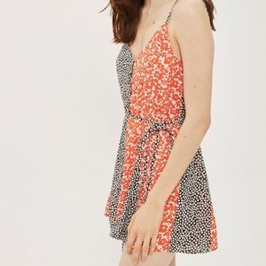 Orange and black floral romper